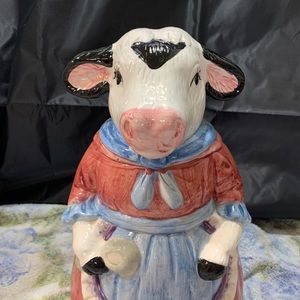 Vintage cow cookie jar with apron and spoon